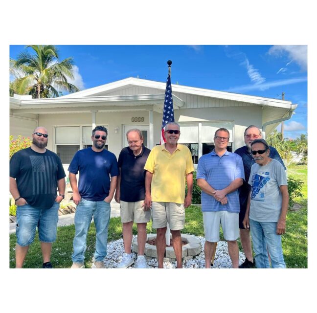 Veterans housed by Warrior Homes of Collier outside one of its homes