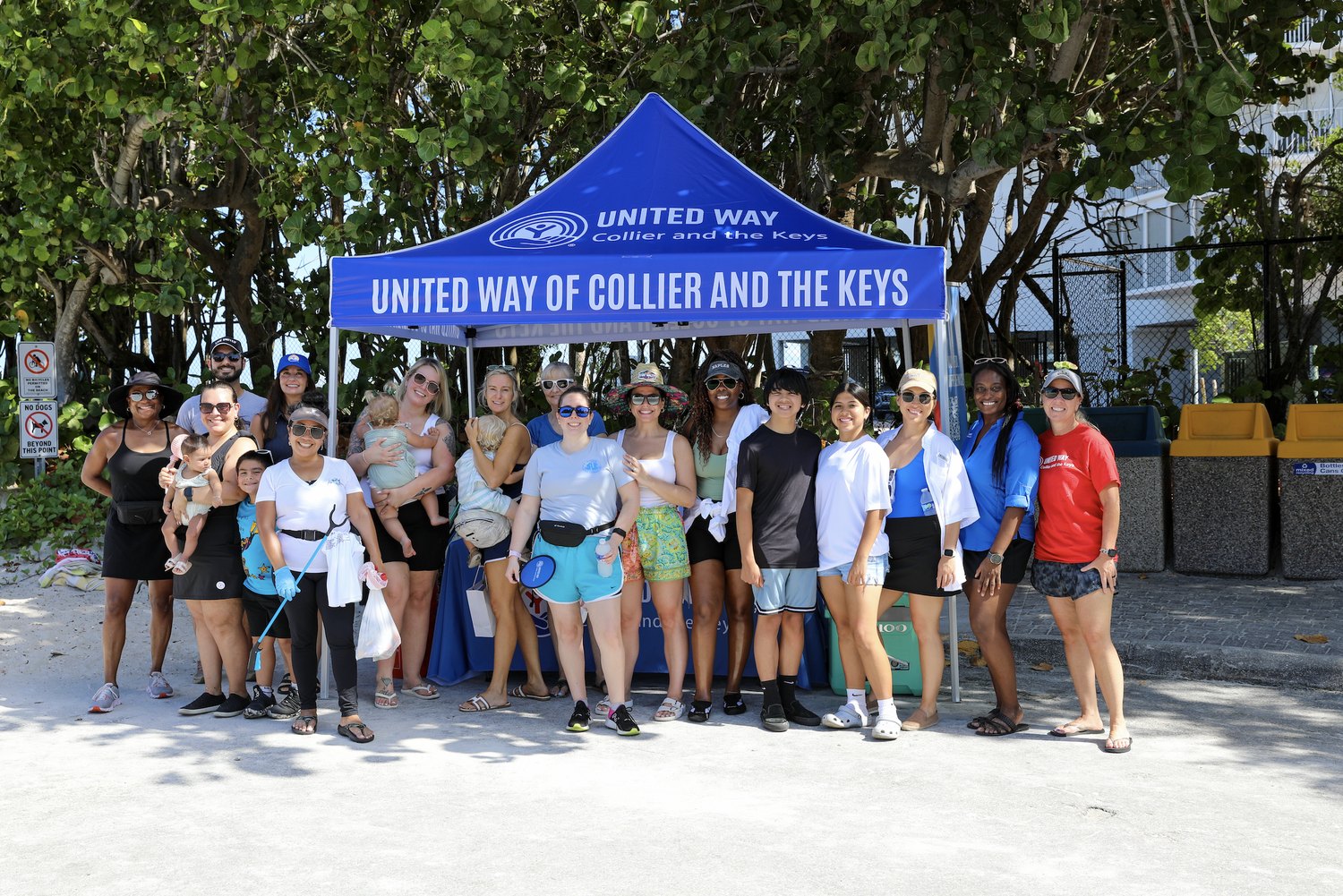 Volunteer group gathered under the United Way of Collier and the Keys tent